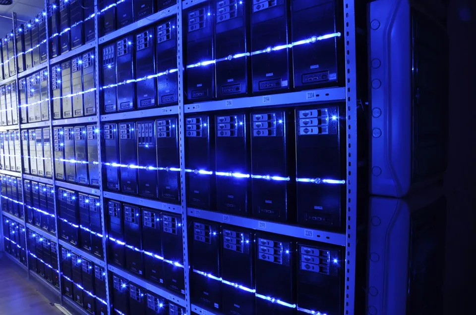 Rows of illuminated server racks in a data centre