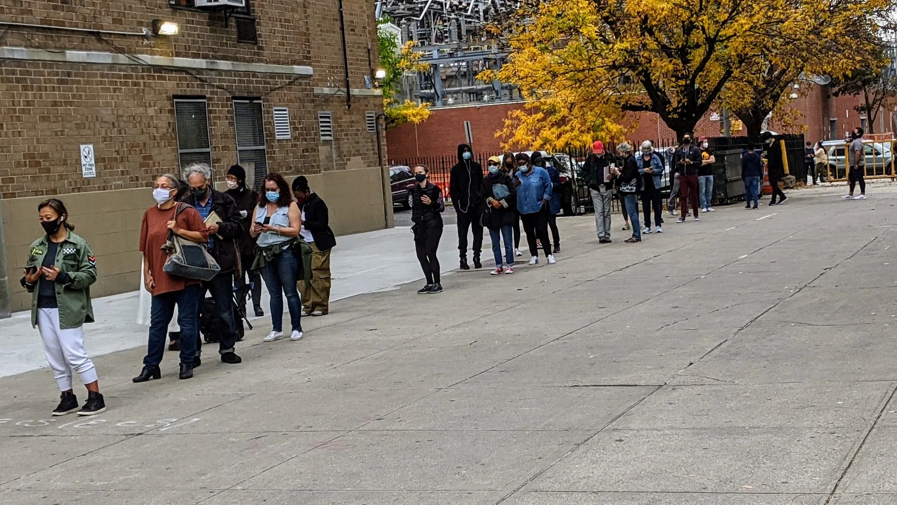 Voters waiting in an early-voting line outside a polling site